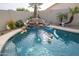 Refreshing pool with waterfall, perfect for cooling off on a hot day at 14741 W Avalon Dr, Goodyear, AZ 85395