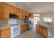 Well-equipped kitchen with ample wood cabinets and a white stove at 15559 E Golden Eagle Blvd, Fountain Hills, AZ 85268