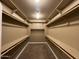 Large walk-in closet with double hanging rods at 18616 W Illini St, Goodyear, AZ 85338