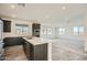 Modern kitchen with island, stainless steel appliances, and dark cabinetry at 2121 W Sonoran Desert Dr # 29, Phoenix, AZ 85085