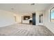 Spacious living room with carpeted floors and access to kitchen at 2121 W Sonoran Desert Dr # 29, Phoenix, AZ 85085