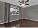 Bedroom with dark stained concrete floors and a ceiling fan at 3809 N 87Th Pl, Scottsdale, AZ 85251