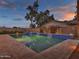 Stunning rectangular pool with waterfall and a spacious patio at 3809 N 87Th Pl, Scottsdale, AZ 85251