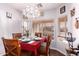 Bright dining room with a chandelier and seating for four at 3820 E Waterman St, Gilbert, AZ 85297