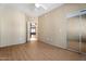 Bright bedroom with mirrored closet doors and wood-look floors at 4343 N 21St St # 203, Phoenix, AZ 85016