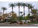 Attractive community entrance with lush landscaping and palm trees at 4343 N 21St St # 203, Phoenix, AZ 85016