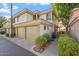 Two-story townhome with attached garage and walkway at 4343 N 21St St # 203, Phoenix, AZ 85016