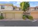 Two-car garage with tan doors and brick driveway at 4343 N 21St St # 203, Phoenix, AZ 85016