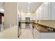 White cabinets, granite counters, and stainless steel appliances at 4343 N 21St St # 203, Phoenix, AZ 85016