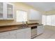Kitchen with white cabinets, granite countertops, and dishwasher at 4343 N 21St St # 203, Phoenix, AZ 85016