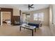 Living room with fireplace, access to balcony, and hardwood floors at 4343 N 21St St # 203, Phoenix, AZ 85016
