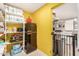 Bright pantry with ample shelving, refrigerator, and laundry area at 4902 W Sheridan St, Phoenix, AZ 85035