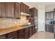 Modern kitchen with gas cooktop and upgraded backsplash at 8443 E Jensen St, Mesa, AZ 85207