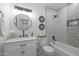 Modern bathroom with a white vanity, bathtub, and hexagon tile at 8532 E Columbus Ave, Scottsdale, AZ 85251