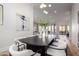 Modern dining room with a black table and white chairs at 11380 E Sand Hills Rd, Scottsdale, AZ 85255