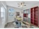 Bright home office features built-in shelving and large window at 1263 E Palo Verde Dr, Casa Grande, AZ 85122