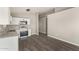 Modern kitchen with stainless steel appliances and hardwood floors at 14126 S Diablo Rd, Arizona City, AZ 85123