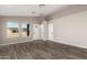 Spacious living room with wood-look floors and neutral walls at 14126 S Diablo Rd, Arizona City, AZ 85123