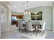 Bright dining room with a view into the kitchen at 14551 W Via Montoya --, Sun City West, AZ 85375