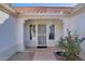 Front entry with a security door and landscaping at 14551 W Via Montoya --, Sun City West, AZ 85375