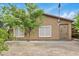 Spacious backyard with mature trees and a gravel landscape at 17132 W Tara Ln, Surprise, AZ 85388