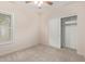 Bright bedroom with ceiling fan and spacious closet at 17132 W Tara Ln, Surprise, AZ 85388