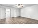 Large bedroom with hardwood floors and access to a bathroom and closet at 17633 N Lindner Dr, Glendale, AZ 85308