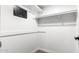 Walk-in closet with built-in shelving and safe at 17633 N Lindner Dr, Glendale, AZ 85308
