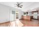 Eat-in kitchen with wood cabinets, granite countertops, and modern appliances at 17633 N Lindner Dr, Glendale, AZ 85308