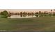Peaceful lake view with ducks and surrounding homes at 17633 N Lindner Dr, Glendale, AZ 85308