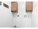 Laundry area with upper cabinets and hookups at 17633 N Lindner Dr, Glendale, AZ 85308