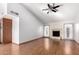 Spacious living room featuring hardwood floors and a fireplace at 17633 N Lindner Dr, Glendale, AZ 85308