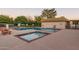 Community pool and spa with seating area at 17633 N Lindner Dr, Glendale, AZ 85308