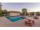 Community pool with seating and shaded areas at 17633 N Lindner Dr, Glendale, AZ 85308