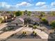 Aerial view of single-story home with circular driveway and landscaping at 17931 W Oregon Ave, Litchfield Park, AZ 85340