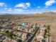 Aerial view of a residential area with a highlighted house and pool at 2122 W Red Range Way, Phoenix, AZ 85085