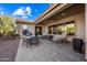 Backyard patio with seating area, grill, and dining table at 2122 W Red Range Way, Phoenix, AZ 85085