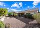 Large backyard with gravel landscaping and desert plants at 2122 W Red Range Way, Phoenix, AZ 85085