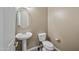 Small bathroom with pedestal sink and toilet at 2122 W Red Range Way, Phoenix, AZ 85085