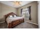 Spacious bedroom with large bed and window coverings at 2122 W Red Range Way, Phoenix, AZ 85085