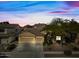 Single-story home with a two-car garage and landscaped front yard at 2122 W Red Range Way, Phoenix, AZ 85085
