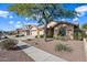 House exterior showcasing landscaping and driveway at 2122 W Red Range Way, Phoenix, AZ 85085