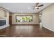 Living room features a large window, fireplace and built-in shelves at 2122 W Red Range Way, Phoenix, AZ 85085