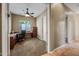 Home office with wood desk and carpet flooring at 2122 W Red Range Way, Phoenix, AZ 85085