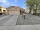 Single-story home with attached garage and desert landscaping at 21857 W Pima St, Buckeye, AZ 85326