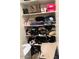 Shelved closet with clothes and shoes at 23094 E Calle De Flores --, Queen Creek, AZ 85142