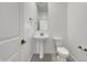 Clean bathroom with pedestal sink and toilet at 2607 E Corazon Trl, Casa Grande, AZ 85194