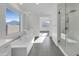 Spa-like bathroom with soaking tub, walk-in shower, and large window at 2607 E Corazon Trl, Casa Grande, AZ 85194