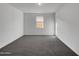 Bright bedroom with gray carpeting and a window at 2607 E Corazon Trl, Casa Grande, AZ 85194