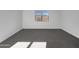 Spacious secondary bedroom with gray carpeting and natural light at 2607 E Corazon Trl, Casa Grande, AZ 85194